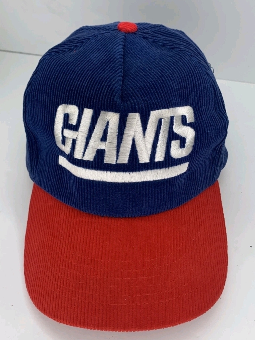 New Era Hat in Blue with Red Logo